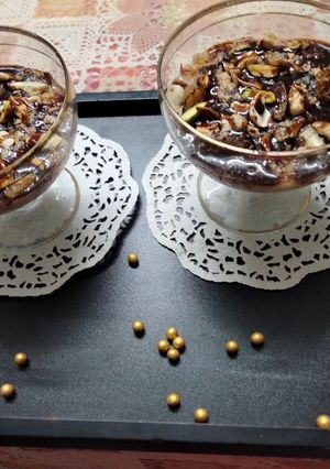 A picture of Oats and rice pudding with chocolate sauce.