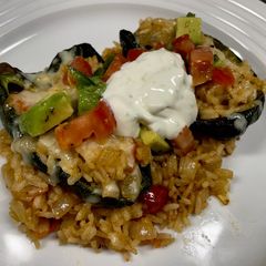 A picture of Cheesy Rice Stuffed Poblanos.