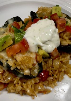 A picture of Cheesy Rice Stuffed Poblanos.