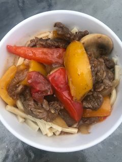 A picture of Pepper Steak with Kluski Noodles.