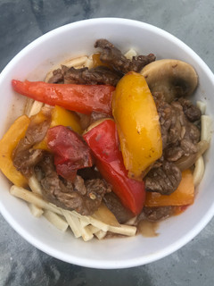 A picture of Pepper Steak with Kluski Noodles.