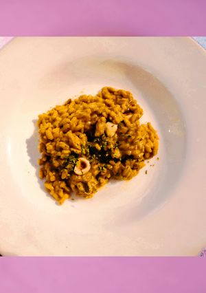 Foto di Risotto cremoso ai funghi, zafferano e nocciole