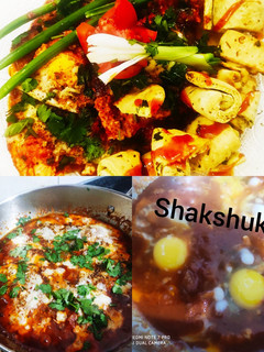 A picture of Shakshuka with warm garlic bread (poached eggs in spicy sauces).
