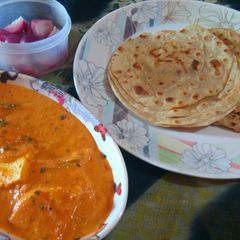 Butter paneer,laccha paratha with onion vinegar salad A picture of Butter paneer,laccha paratha with onion vinegar salad.