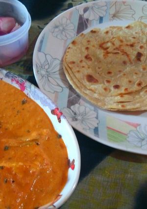 A picture of Butter paneer,laccha paratha with onion vinegar salad.