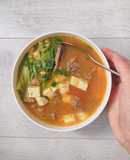 Canh bò nấu đậu chua cay