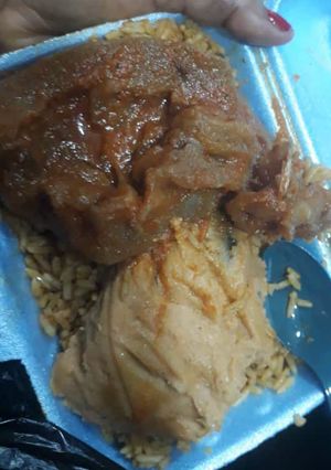 A picture of Jollof,moimoi and pomo.