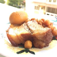 A picture of Spicy Pork Belly With Chickpea And Eggs.