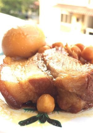 A picture of Spicy Pork Belly With Chickpea And Eggs.