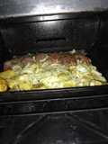 Peceto al horno con papas y cebollas