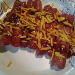 A picture of cheesy splitdogs.