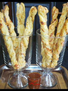 A picture of Cheese And Chives breadsticks.