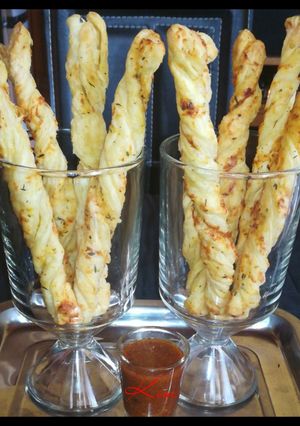A picture of Cheese And Chives breadsticks.