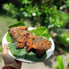 A picture of Pumpkin Leaf Red Lentil Fritters(Kumropataye Musur Daler Bora).