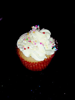 A picture of Vanilla cupcakes and butter icing.
