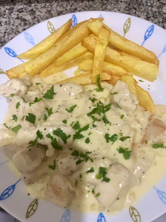 Una foto de Pollo al queso rallado