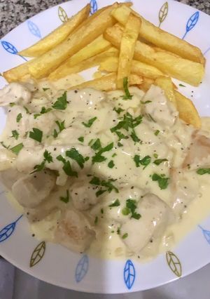 Una foto de Pollo al queso rallado