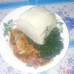 A picture of Ugali with fried sukamawiki and beef stew.