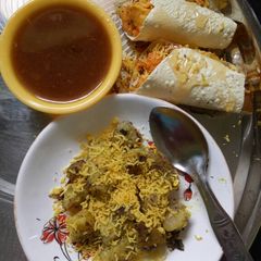 A picture of Chatpata sweet potato with khata mitha papad roll.