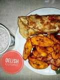 Fried plantain and eggs with a cup of hot tea