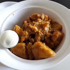 A picture of Yam and ripe plantain porriage with boiled egg.