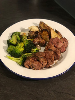 A picture of Curried lamb neck, roast Jerusalem artichokes and garlic broccoli.