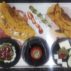 A picture of Stuffed besan rice chilla.