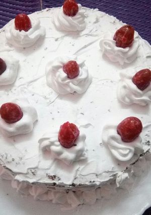 A picture of Chocolate cake with whipped cream.