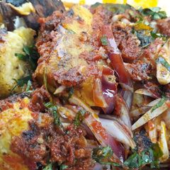 Roasted plantain with pepper sauce A picture of Roasted plantain with pepper sauce.