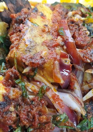 A picture of Roasted plantain with pepper sauce.