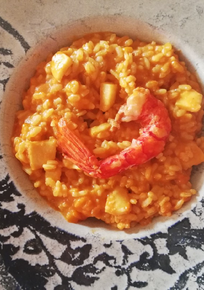 Una foto de Arroz con carabineros y calamares