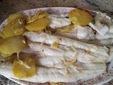Pescada abierta al horno con patatas