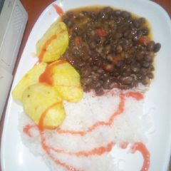A picture of Rice black beans and fried potatoes.