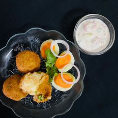 A picture of Potato Cheese Balls With curd dip.