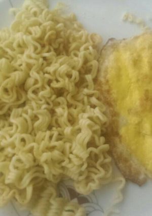 A picture of Indomie and fried egg for breakfast.
