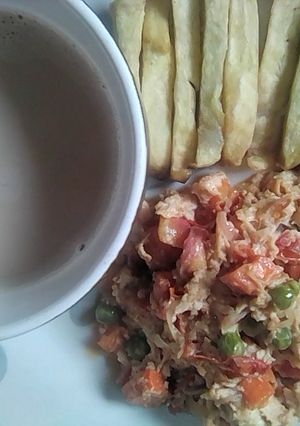 A picture of Chips & Chicken egg sauce with cocoa drink.