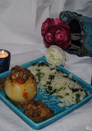A picture of Stuffed onions with spinach rice.