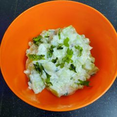 A picture of Curd cucumber raita.