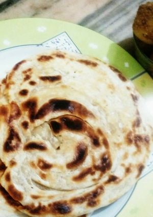 A picture of LACHHA PORATHA with CHOTA ALOO CURRY.