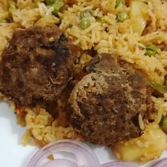 A picture of Mater pulao with shami kabab.