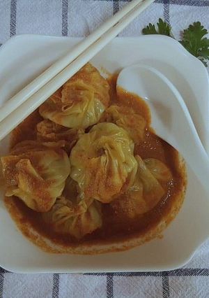 A picture of Homemade Nepali Jhol momo (dumpling with soup).