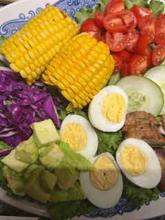A picture of Chicken salad with honey mustard dressing / garlic bread.