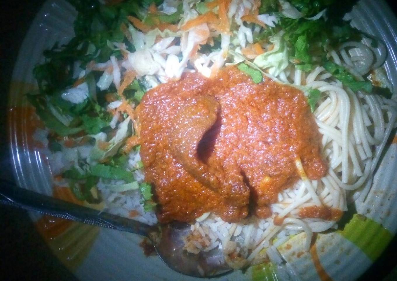 Rice, spaghetti with stew and salad
