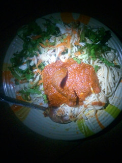 A picture of Rice, spaghetti with stew and salad.