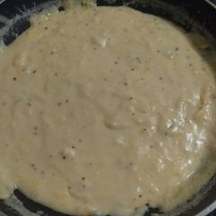 A picture of Elisa's Garlic & Herb Cheese Sauce.
