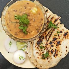 A picture of Dal makhani and Butter naan.