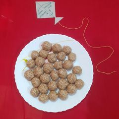 Til jaggery laddu A picture of Til jaggery laddu.