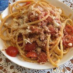 A picture of Bucatini Puttanesca with Sausage.