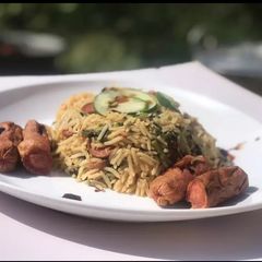 A picture of Spicy sausage and spinach rice.