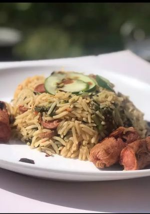 A picture of Spicy sausage and spinach rice.